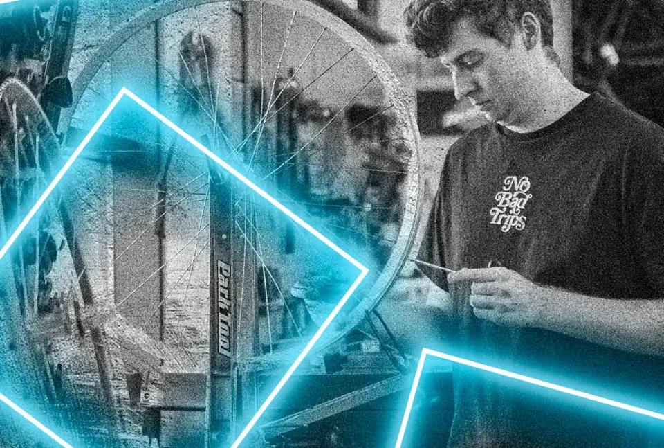 Workshop mechanic building a wheel