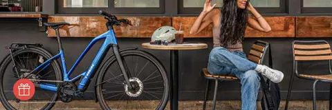Man riding a hybrid bike through the city