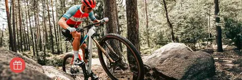 Woman riding a mountain bike down hill