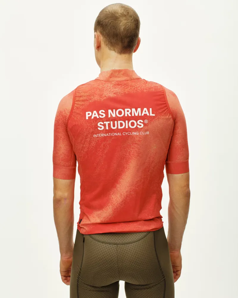Pas Normal Studios Mechanism Stow Away Gilet in AOP Hibiscus Orange-3