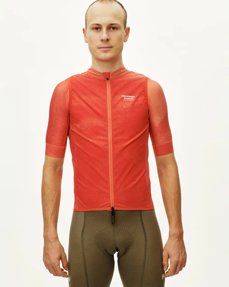 Pas Normal Studios Mechanism Stow Away Gilet in AOP Hibiscus Orange-2
